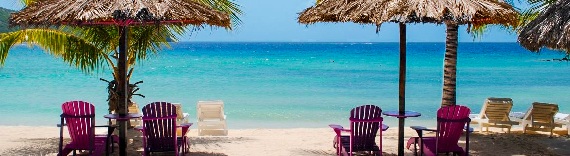 Loungechairs and umbrellas on a Southwest Florida beach.